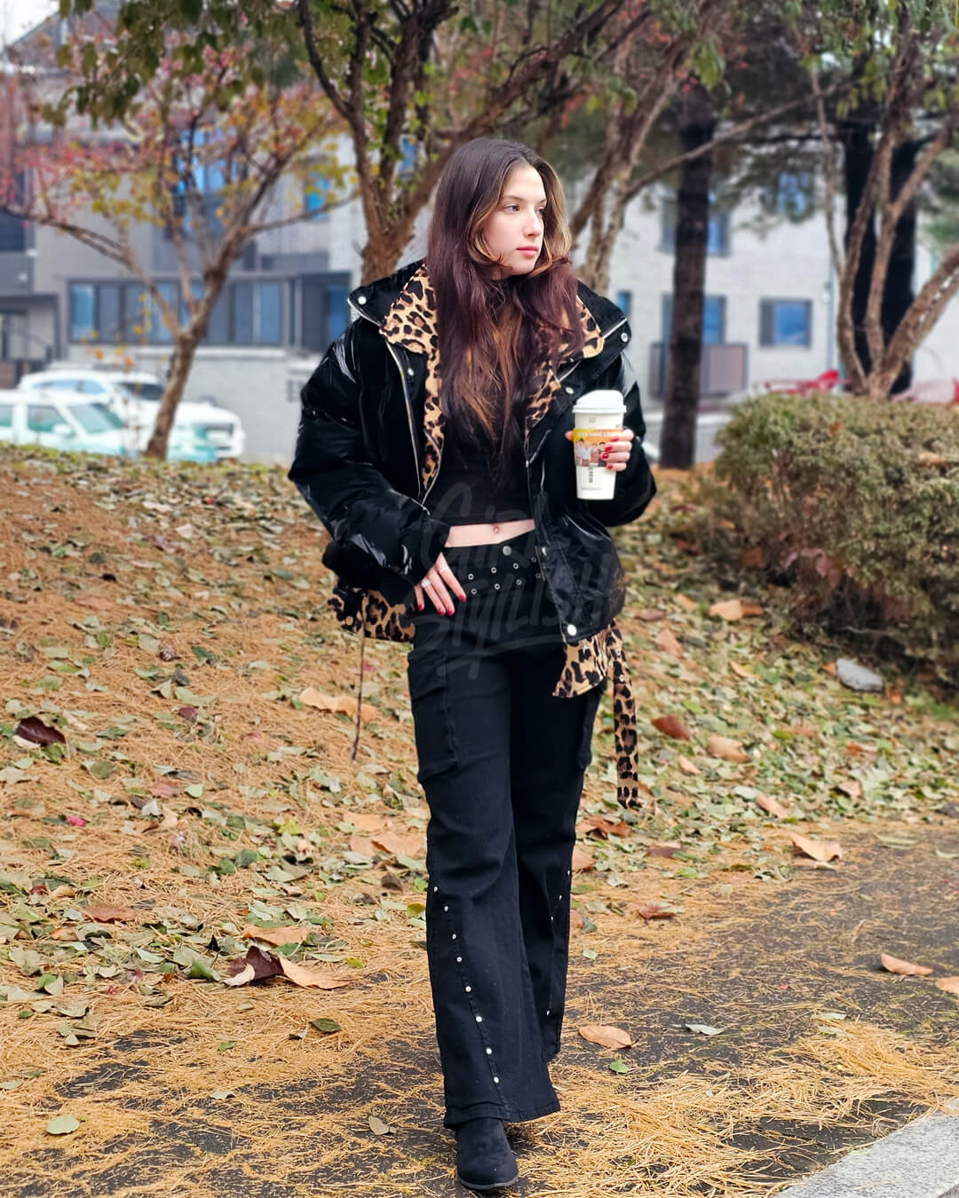  Oversized padded jacket featuring glossy black enamel with an integrated leopard layered detail